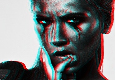 portrait processed in the style of three-dimensional graphics of a young beautiful girl in red light with a crying make-up holds a finger in her mouth