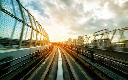 front view of train moving through city rails. concept of rails transportation