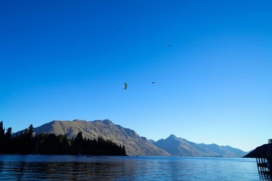 tandem paragliding over lake wakatipu in queenstown, new zealand
