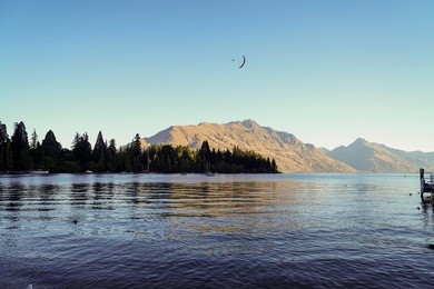 tandem paragliding over lake wakatipu in queenstown, new zealand