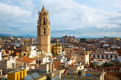 general view on city and cathedral in reus in evening 