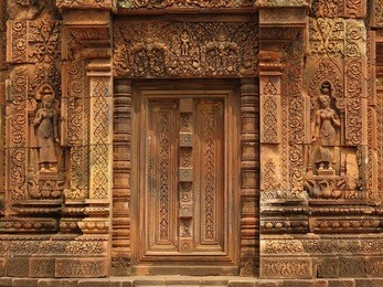 intricately carved door at banteay srei complex in cambodia