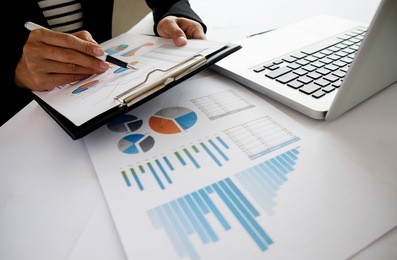 business concept. business people discussing the charts and graphs showing the results of their successful teamwork. selective focus.