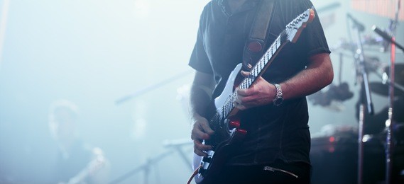 guitarist performing on stage. concert