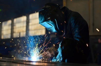 welders working at the factory made metal