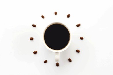 coffee cup on saucer and coffee beans against white background forming clock dial.c offee as symbol of morning energy and cheerfulness or evening refreshment.