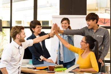 multi ethnic business person group in casual suit celebrate after their project successful in modern office. project and business concept.
