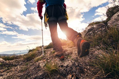 traveler feet hiking in mountains