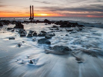 "shoreline long exposure"
a long exposure photo of a section of beach at sunset. 