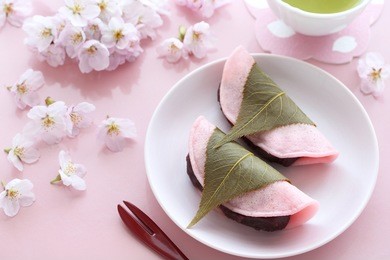 japanese traditional confectionery,sakura mochi wrapped with salted cherry leaves and cherry blossoms  