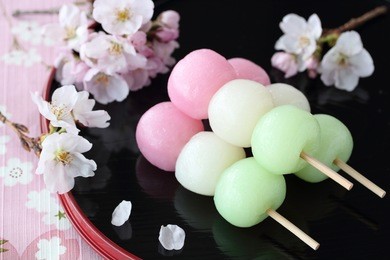 japanese traditional confectionery,three color dumplings with cherry blossoms 