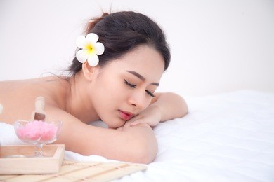 asian beautiful young lady wellness enjoying relaxing receiving back massage and essential oil aroma therapy in cosmetology spa salon center after work.
. body skin care beauty treatment concept.