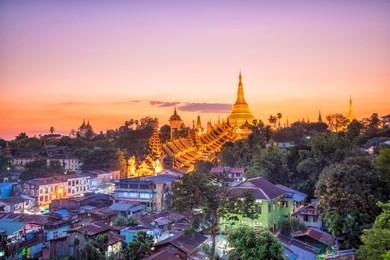 yangon skyline at twilight with shwedagon pagoda  in myanmar
