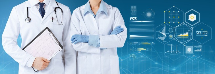 healthcare, people, cardiology and medicine concept - smiling doctors with stethoscope and cardiogram on clipboard over blue background and virtual charts