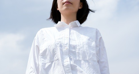 white shirt woman and blue sky