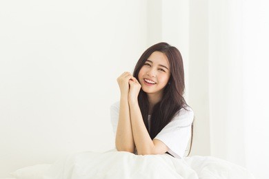 young asian girl waking up in the morning