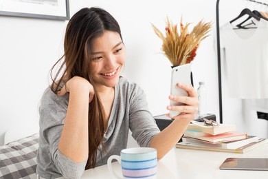 young asian girl doing video call