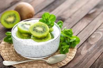 fresh kiwi yogurt with fruits and chia seeds, healthy breakfast