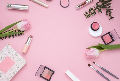 cosmetic pink frame with flowers. top view. flat lay
