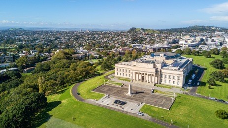 aerial view on auckland domain and war memorial museum with residential suburb on the background. auckland, new zealand