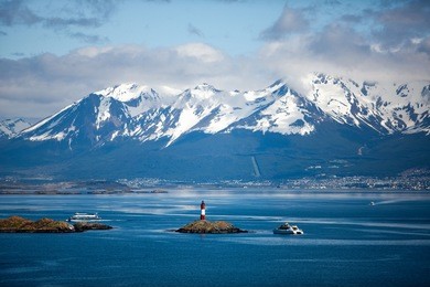tierra del fuego,  landscape of snowy and wooded mountains and ocean