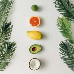 creative layout made of summer tropical fruits and leaves. flat lay. food concept.