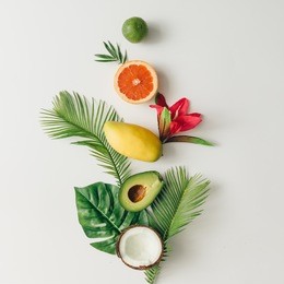 creative layout made of summer tropical fruits and leaves. flat lay. food concept.