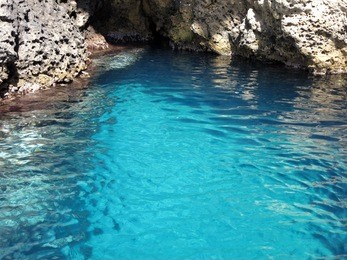 the grotta azzurra, isola bella, at the beach of mazzaro, taormina, sicily.