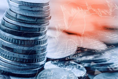 double exposure of stack of coins and technical charts of financial instruments with stock price quotations on a digital panel. currency exchange and trading or forex and stock market analysis concept