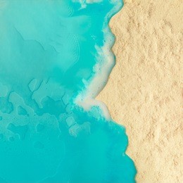 creative minimal beach concept. summer vacation layout with blue water and sand on bright background. flat lay.