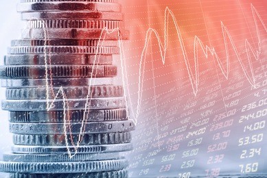 stack of coins and technical charts of financial instruments with digital display in retro tone effect. currency exchange and trading or forex and stock market trade analysis for fund manager concept.