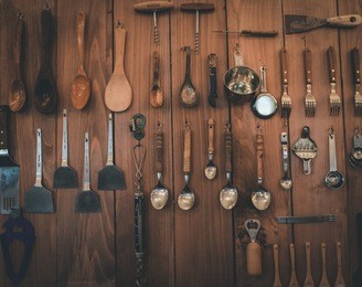 kitchenware on wooden wall
