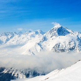 beautiful top veiw of dombaj mountains with clouds and valley, close up