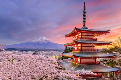 fujiyoshida, japan at chureito pagoda and mt. fuji in the spring with cherry blossoms.
