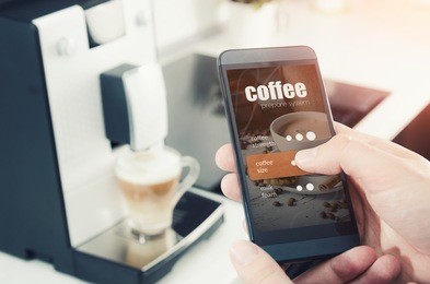 making coffee from smartphone, modern coffee maker. coffee machine wireless prepare internet smartphone technology application concept