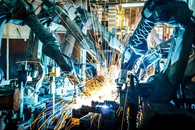 team welding robots represent the movement in the automotive parts industry.