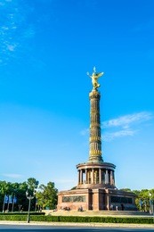 victory column in berlin on sunny day with blue bright sky.