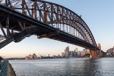 beautiful sunrise over opera house and sydney harbour bridge viewed from kirribilli in north sydney.