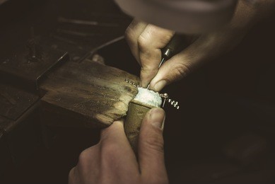 jeweler makes a piece of jewelry