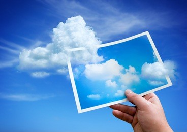 clouds rising up from a picture.