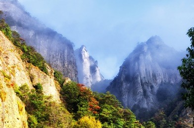 early morning clouds hanging over yandangshan or yandang mountains in china in zhejiang province.