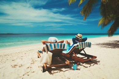 happy couple relax on a tropical beach