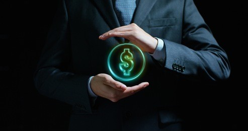dollar in the hands of an experienced seller or bank or insurance broker concept: for investment and passive income, for retirement and annuities also the concept of insurance or bank, currency growth