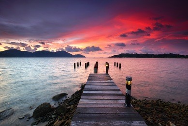 beautiful sunset view over the wooden jetty in marina island, lumut perak malaysia. nature composition.