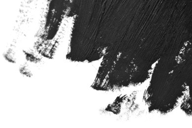 black brush strokes oil paints on white paper. isolated on white background. abstract creative background