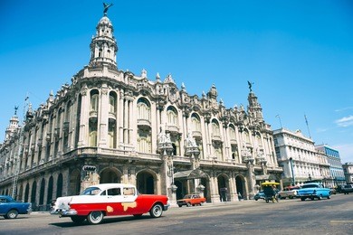 colorful scenic view of a typical street scene in central havana, cuba