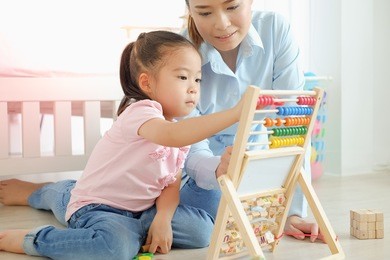 mother and daughter playing toys