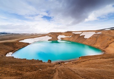 caldera volcano with turquoise water. lake krafla, a tourist attraction of iceland. geothermal valley leirhnjukur