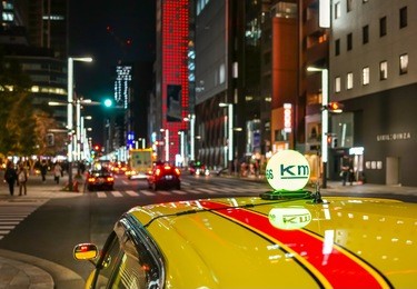  neon tokyo taxi sign at ginza  street at night, japan.