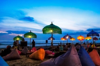 enjoy sunset at seminyak (kuta) bali - indonesia